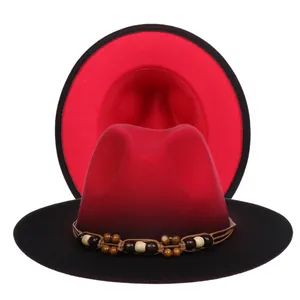Detail of red and black wide brim fedora with wooden bead and braided rope band