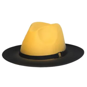 Detail of wool felt fedora with yellow crown, black brim, and metal decorative buckle