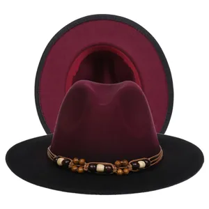 Detail view of two-tone wool fedora with bohemian beaded band and wide brim design