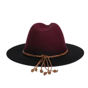 Detail of wool fedora with burgundy crown, black brim and leather beaded cord