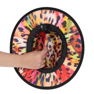 Detail of wool fedora interior showing colorful leopard print and adjustable drawstring