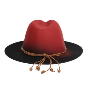 Detail of red and black gradient wool fedora featuring a woven cord and wooden beads
