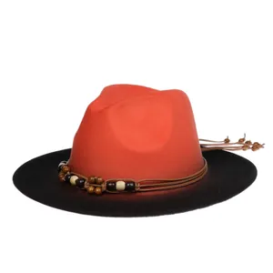 Detail of bohemian fedora with orange-brown gradient wool felt and wooden bead band