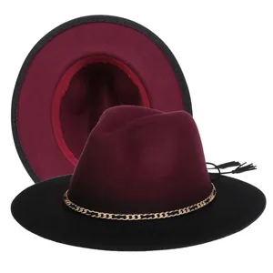 Detail of two-tone wool fedora hat with metal chain trim and elegant fringe accent