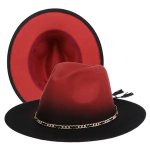 Detail of red and black gradient fedora with gold chain, black fringe and red lining