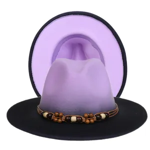 Detail of purple gradient fedora with black brim and ethnic beaded woven band decoration