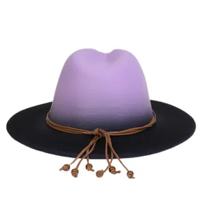 Detail of gradient purple to black wool fedora with brown leather cord and wood bead
