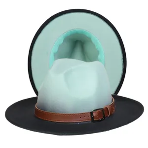 Détail d'un chapeau fedora bicolore avec doublure vert menthe et boucle en cuir marron