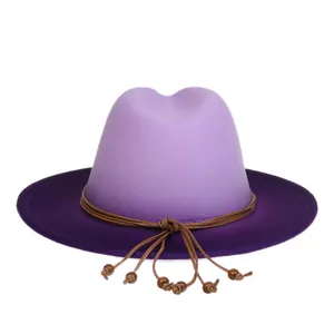 Detail of two-tone wool fedora with purple gradient and wooden bead tassel decoration
