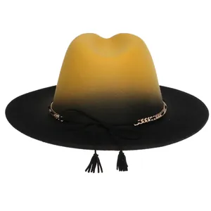 Detail of yellow and black gradient wool fedora with gold chain and tassel accent