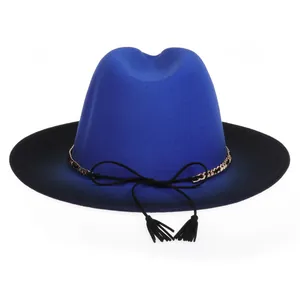 Detail of royal blue fedora hat with gold chain and black tassel accent on wide brim