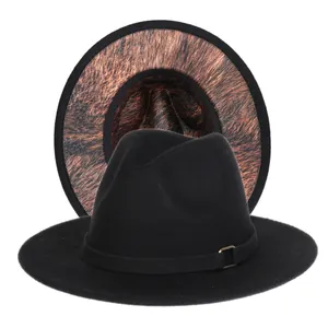Detail of wool fedora hat with black exterior and leopard print pattern on the inner brim
