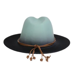 Detail of gradient fedora hat featuring beaded cord trim and wide brim texture
