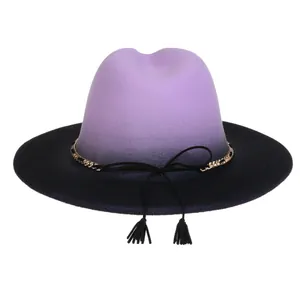 Close-up of purple and black gradient fedora hat with gold chain and tassel detail