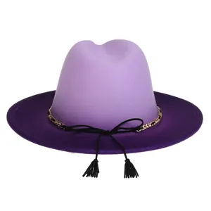 Detail of two-tone lavender fedora hat with gold metal chain and tassel decoration