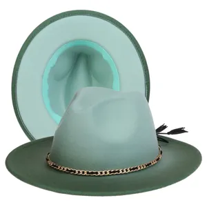 Detail view of two-tone fedora hat in mint and dark green with chain and tassel