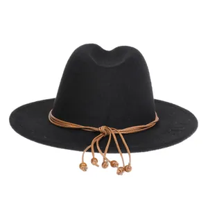 Detail of black wool felt fedora featuring a brown beaded rope band decoration