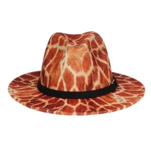 Close-up of giraffe pattern fedora hat featuring a black fabric decorative band