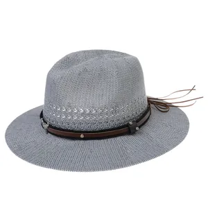 Detail of grey woven fedora with silver bull head charm and brown leather band