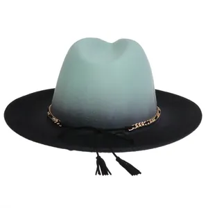 Detail of mint green to black gradient wool fedora with gold chain and tassels