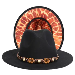Detail of black fedora hat with multi-colored wooden beads and giraffe print lining
