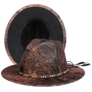 Detail of leopard print wool fedora hat with gold metal chain and black tassel accents