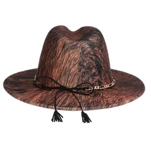 Detail of fedora hat featuring brown animal fur texture and gold chain tassel decor
