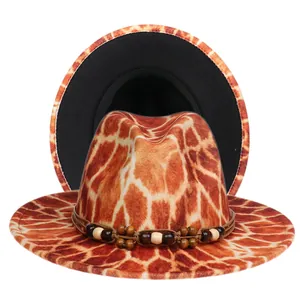Detail of wide brim fedora with giraffe print, wooden bead band, and black inner lining