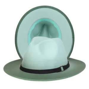 Close-up of wide-brim wool fedora hat in green color-block design with metal buckle
