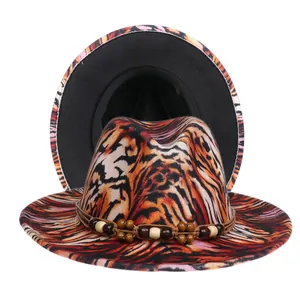 Detailed close-up of tiger print wool fedora hat with beaded band and black interior