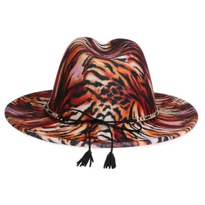 Detail of tiger print wool fedora featuring a delicate metal chain and black tassel tie