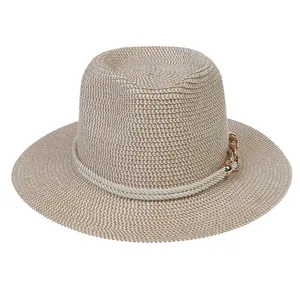 Detail of mixed-weave straw hat with white rope band and gold metal chain hardware