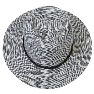 Close-up of blue and white woven straw fedora with black rope and wooden heart pendant