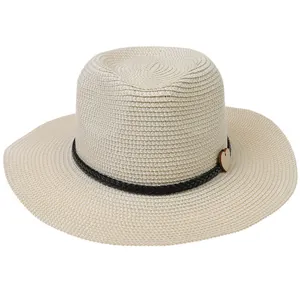 Detail of cream boater hat with black woven band and a small wooden heart charm