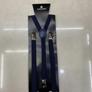 Detail view of navy blue Y-back elastic suspenders with three silver metal clips for boys