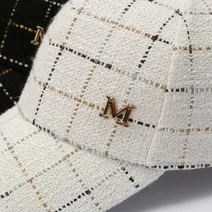 Winter tweed baseball cap with gold M logo and rhinestone plaid pattern in cream