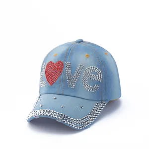 Macro detail of rhinestones on denim baseball cap featuring LOVE text and studs