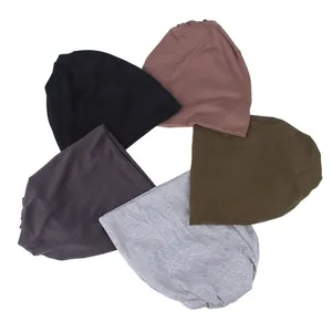 Detailed view of five breathable cycling neck gaiters in various neutral colors