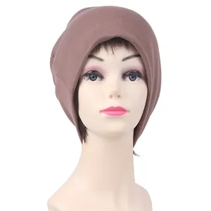 Detail showing the fine knitted texture and breathable fabric of a brown cycling beanie cap