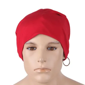 Detailed close-up of soft red knitted beanie fabric and clean stitching texture