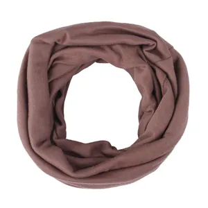 Detailed view of dark brown knitted infinity scarf showing textured seamless fabric pattern
