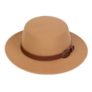 Detailed view of camel wool fedora hat with brown leather band and metal buckle