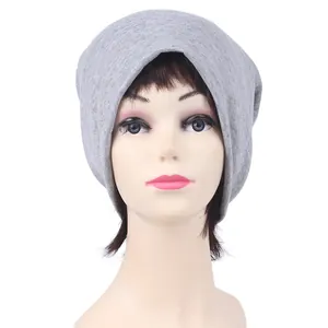 Detailed view of a light gray slouchy knit beanie on a model head for cycling and outdoor sports