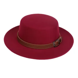 Detailed view of burgundy wool felt fedora with a brown leather belt and metal buckle