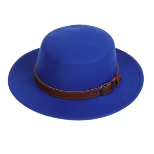 Close-up of royal blue wool fedora with a brown leather strap and silver metal buckle