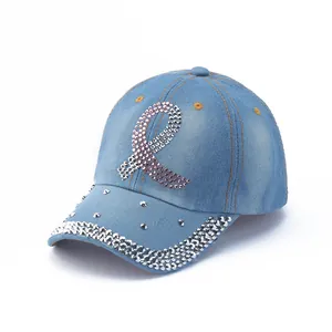 Close-up of pink and silver rhinestones on a light blue washed denim baseball cap