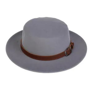 Detail of grey wool felt fedora with brown leather strap and metal buckle closure