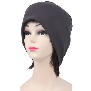 Detail of dark grey seamless knitted beanie showing soft ribbed texture and slouchy fit