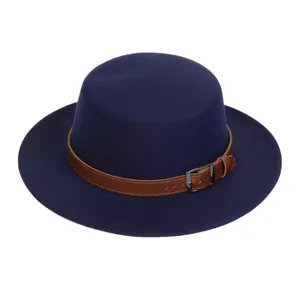 Detail of navy wool felt fedora with brown leather strap and metal buckle buckle