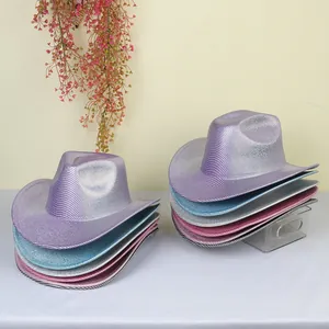 Close-up of metallic cowboy hats in purple, blue, and pink showing shiny texture